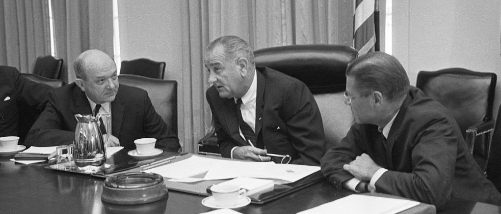 Secretary of Defense Robert McNamara (right), President Lyndon Baines Johnson, and Secretary of State Dean Rusk, seated at a table after McNamara’s return from South Vietnam, 1965 | Library of Congress!''